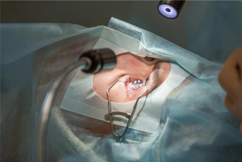 A person with glasses wonders if getting LASIK surgery in Los Angeles is worth it